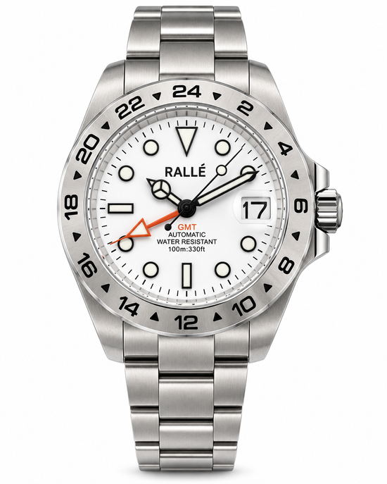 A stainless steel wristwatch with a white dial, black bezel markings, and a silver metal link bracelet. The dial features a white date window, black hour markers, and a distinctive orange accent hand.