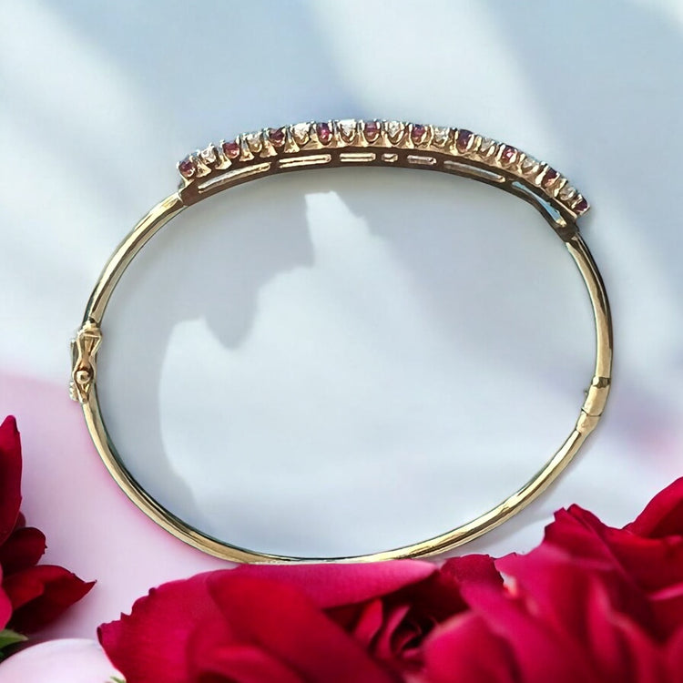 Rallé Stunning 14K Yellow Gold Ruby & Diamond Bangle - Detail close-up of ruby and diamond arrangement showing refined craftsmanship.